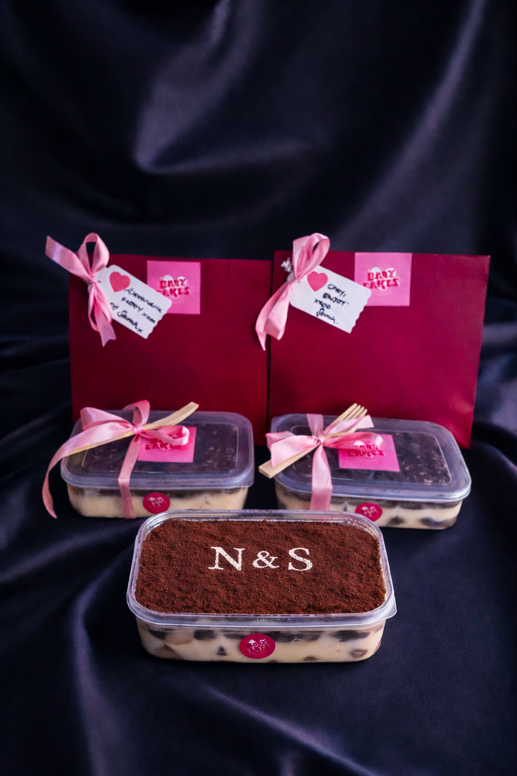 Valentine’s Personalised Tiramisu 💋. Rich, creamy, indulgent and finished with hand-sifted cocoa initials. 
She’s a generous 1 litre- so 4 generous serves (OR keep it all for yourself✨).